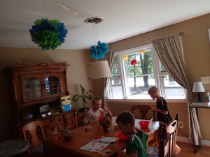The boys made paper flowers and a piñata!