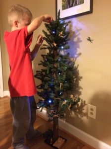 The boys decorated the little tree with Army men.